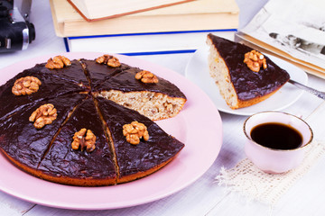 Homemade honey walnut and chocolate pie, cup of coffee
