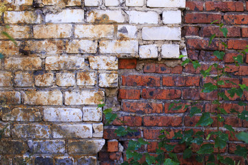 poor quality construction. substandard work on building a brick wall. sloppy brickwork silicate bricks, mixed ceramic bricks