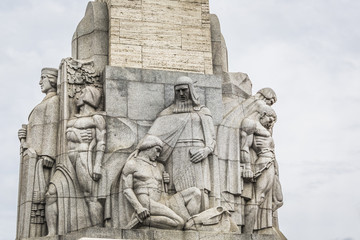 Monument of freedom. woman holding three gold stars which symbol