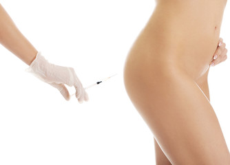 Injection before surgery on a woman's bottom