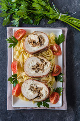 Rolled meat with champignons and cheese