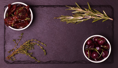 Food frame on dark stone background.