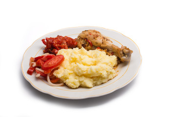 meat, lettuce, tomatoes, peppers and potatoes on a plate