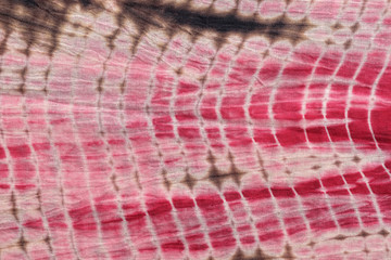 Abstract Background of  Red,White,and Pink Tie and Dye Cloth.