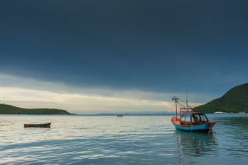 Boats floating on the sea in fishing village