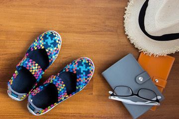 Travel concept with beautiful shoes, hut , glasses and notebooks