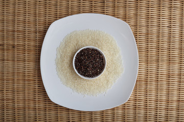 Mixture of dark brown and white rice on two white plates