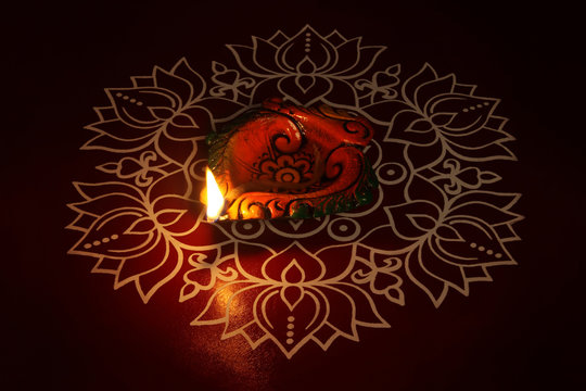 Indian Traditional kolam with Oil Lamp