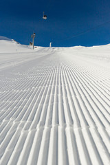 Fototapeta na wymiar Groomed ski run at ski resort