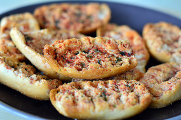 Italian bruschetta bread with tomato and oregano on a plate
