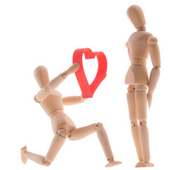 two wooden figure dummy mannequin, give romantic gift a big red heart, made of paper tape in the shape of heart isolated on a white background - pictures concept theme Love and St. Valentine's Day