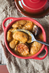 Plate with fabada asturiana, a typical spanish bean stew