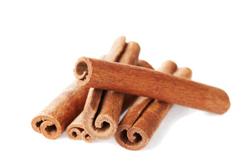 Closeup of cinnamon sticks on white background