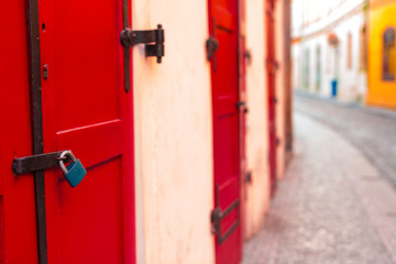 Red wooden door with lock