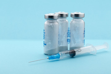 Healthcare and medicine,syringe, medicine bottle on blue