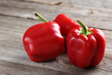 Red peppers on a grey wooden background