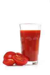 Fresh red tomatoes and tomato juice in glass isolated on white