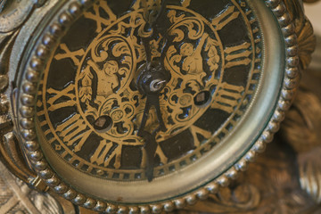 Fototapeta na wymiar Antique clock with roman numerals