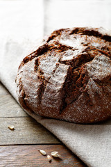 Crispy black bread on a linen napkin
