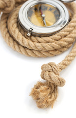 ship rope and compass isolated on white