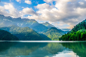 A view of the water and the mountains Lake Ritsa