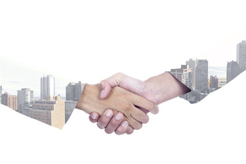 Double exposure of businesspeople shaking hands