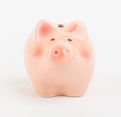 Small piggy bank on white, front view