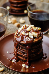 chocolate pancake with bananas walnuts and chocolate sauce