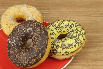 Sweet donuts with coffee. Sweet treat with coffee. Donuts as quick homemade treats. Junk food diets enemy. A symbol of junk food and obesity, donut for a snack.
