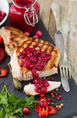 Grilled meat with cranberry sauce