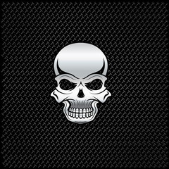 silver skull on metal background