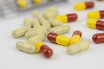 Yellow and red capsules isolated