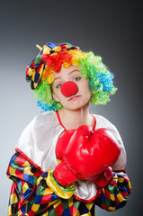 Funny clown with boxing gloves
