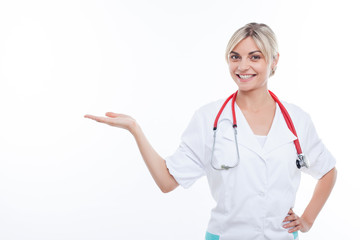 Cheerful young general practitioner is presenting her job