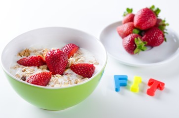 Homemade fruit plate with yogurt, strawberries on white backgrou