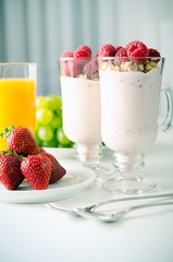 Glass of dessert with fresh berries, muesli and yoghurt