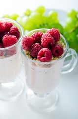 Glass of dessert with yoghurt, fresh berries and muesli