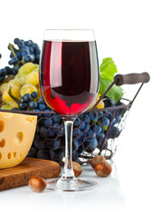 Glass red wine with grapes and cheese. Isolated on white