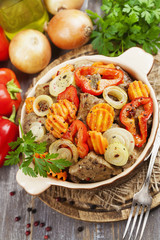 Liver fried with vegetables in the ceramic pot