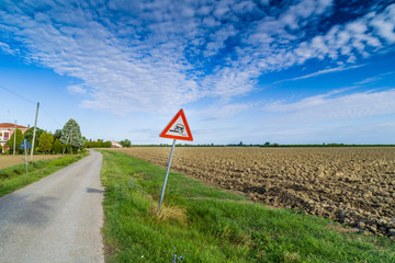 Hazardous Shoulder road sign on in Italian countryside
