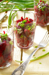 Fresh beetroot salad with bunch-onion in glasses