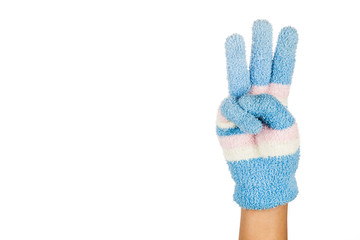 Hand in blue winter glove gesture number three against white background