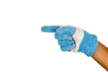Hand in blue winter glove pointing direction against white background