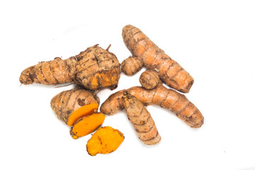 Fresh turmeric roots with healing properties on white background