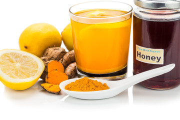 Turmeric roots with lemon and honey drinks, powerful healing beverage