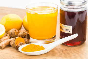 Turmeric roots with lemon and honey drinks, powerful healing beverage