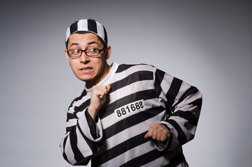 Young prisoner against gray