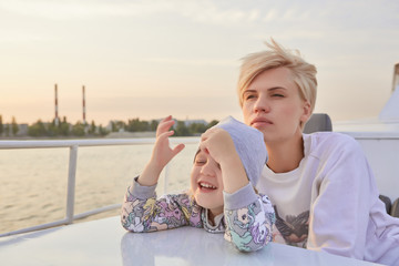 Mother, daughter on yacht or catamaran boat