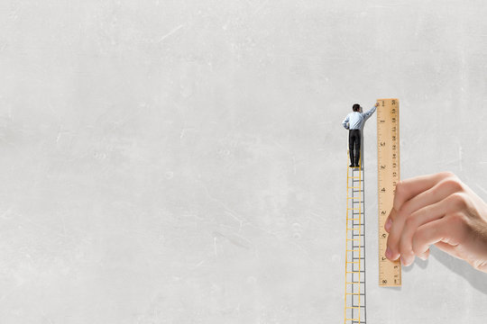 Businessman on ladder