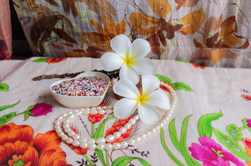 Fototapeta na wymiar beautiful white flower plumeria decorated in boutique and vintage style background